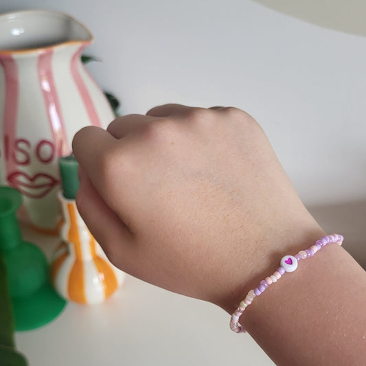 Light pink bracelet with heart charm